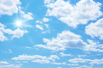 Wall Mural - blue sky with sun and clouds background
