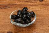 Fototapeta Kuchnia - Black olives in the bowl
