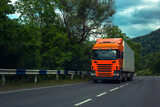 Fototapeta Mapy -  truck driving on a road.