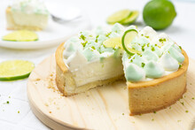 Key Lime Cheese Tart With Whipping Cream On The Table