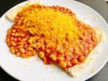 Baked Beans On White Toast With Grated Cheese