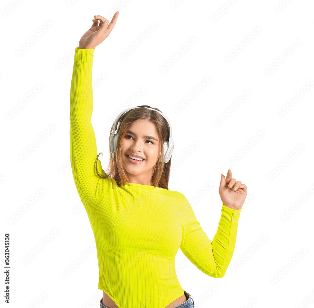 Beautiful young woman with headphones on white background