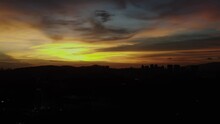 Aerial Drone Shot Of A Sunset Showing Kuala Lumpur's Botanical Garden. Beautiful Scenery, Yellow Dark Colors And Nature.
