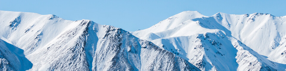 Poster - Mountain peaks. Snow covered mountains in winter.