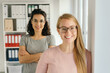 © contrastwerkstatt - Two young businesswomen posing together
