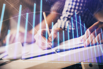 multi exposure of two men planing investment with stock market forex chart.