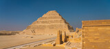 Fototapeta Krajobraz - Djoser (Step Pyramid) the first pyramid built in Egypt, Saqqara, Lower Egypt. Panoramic banner portion