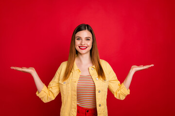 Sticker - Photo of beautiful pretty lady holding two open palms arms advising novelty product low price shopping pick one wear casual yellow blazer jacket isolated bright red color background