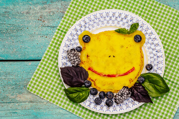 Funny froggy pancake for kids with fresh blueberries