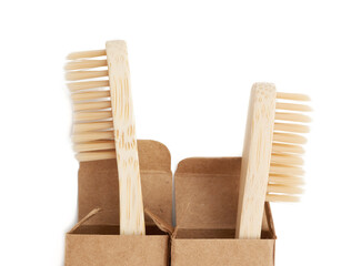 two wooden toothbrushes on a white background, plastic rejection concept