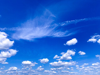 Wall Mural - Magnificent aerial white clouds on a blue sky.