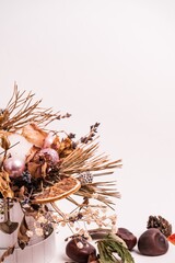 Sticker - Closeup shot of dried plants and fruits isolated on a white background