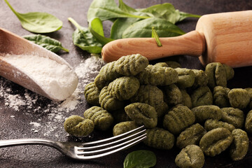 Wall Mural - hand made gnocchi with fresh Spinach. italian traditional gnocchi on background