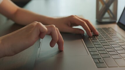 Fototapete - close-up of woman hands touching on laptop keyboard on the table.
