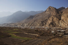 Small Village Close To Giant Rock Mountain Near Muktinath Temple At Mustang, Nepal. Blue Sky Sunny Day.