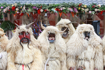 Wall Mural - Moscow Maslenitsa Festival 2020. Traditional national celebration in folk style. Slavic tradition. Performance with Hungarian masked artists. Buso from Hungary. Busojaras holiday in Moscow. Beast