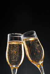 Wall Mural - Glass full of champagne on black background