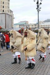 Wall Mural - Moscow Maslenitsa Festival 2020. Traditional national celebration in folk style. Slavic tradition. Performance with Hungarian masked artists. Buso from Hungary. Busojaras holiday in Moscow. Beast