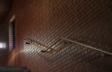 Wall Mural - Handrail of the stairs of the brick wall