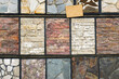 Colorful samples of a stone tile in store. Marble and granite flooring a most popular choice for modern kitchens and bathrooms. Assortment of samples of floors in the store.
