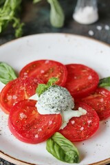 Sticker - tomatoes and unsweetened ice cream from basil (basil mousse). savory ice cream, restaurant serving. unusual recipe,