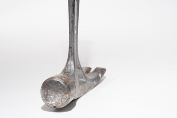 Close-up of the head of a Capenter's claw hammer isolated on a white background