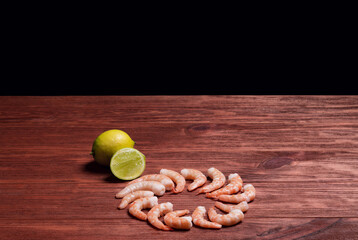 Wall Mural - Premium raw shrimp. Fresh and raw shrimp on wooden table.