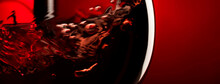 Red Wine On Red Black Background, Abstract Splashing. Macro Shot. Panoramic Banner With Copy Space