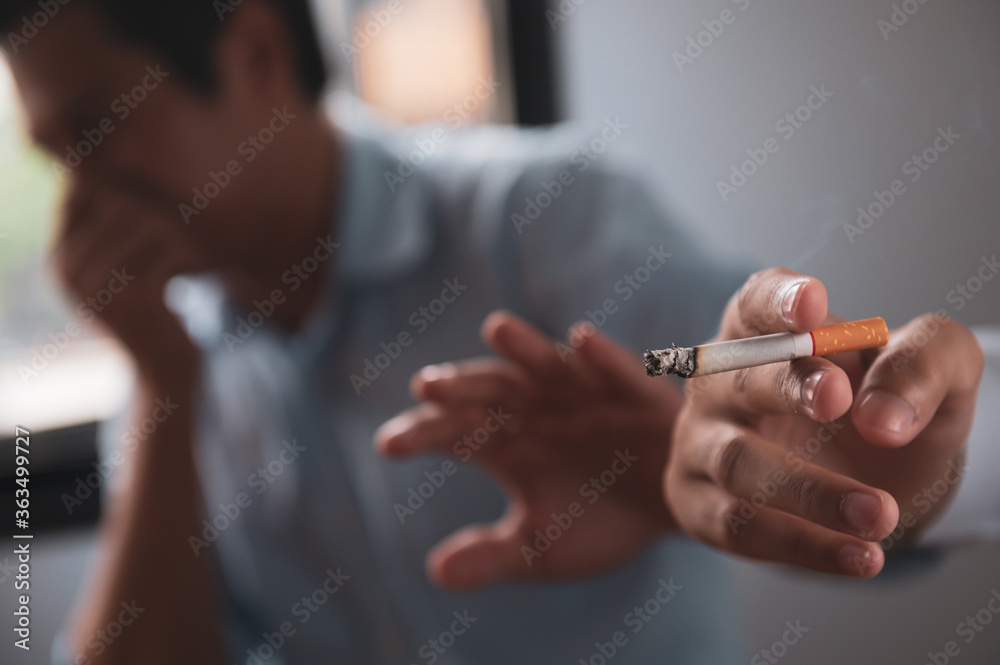 Healthcare or No tobacco day concept : Smoker smoking cigarette been hate  or object by nearby people. Stock Photo