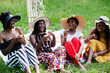 © AS Photo Family - Group of african american girls celebrating birthday party and eat muffins outdoor with decor.