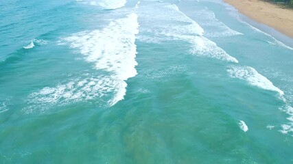 Wall Mural - Aerial view of tropical sandy beach and blue ocean. Top view of ocean waves reaching shore on sunny day. Travel concept. Nacpan beach, Palawan, Philippines.