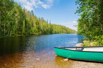 Wall Mural - View of the canyon lake Julma-Olkky and canoe on the shore, Hossa National Park, Kuusamo, Finland