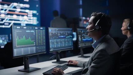 Poster - Confident Male Trader Talking into Headset Works on Computer with Screen Showing Finance Statistics, Charts Strategy, Stock. Big Stock Firm Monitoring Room with Team of Stock Market Specialists