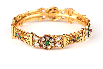 Indian golden Bangles. Bracelet with diamonds and stones on a white background, Indian Traditional Jewellery,Style, fashion and design of jewelry