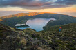 © romylee - a couple of hikers observing the sunset from Lagoa do Fogo on the island of Sao Miguel
