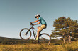 © Tommaso Lizzul - Man riding his mountain bike outdoor in nature