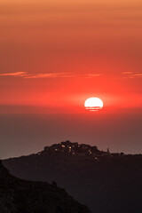 Sticker - Sun setting over the village of Sant'Antonino and Mediterranean