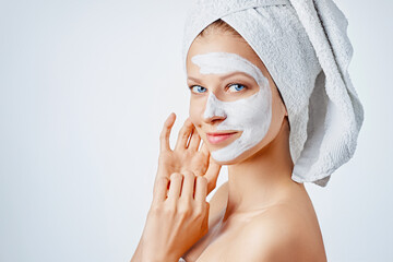 Wall Mural - cosmetology, skin care, face treatment, spa and natural beauty concept. woman with facial mask.