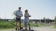 © stanis88 - Young couple with electric scooters on a date in the summer park