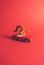 Red Dinosaur And Car
