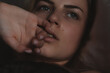 © Oleksii Syrotkin/Stocksy - Sexy and attractive woman touching her face.