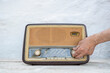 © BIG BLUE PRODUCTIONS SINGLE MEMBER PC - VAT 801021892/Stocksy - Antique radio on vintage table