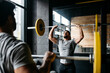 © Sergio Marcos/Stocksy - A group of men training in a crossfit box