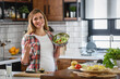 © lordn - Beautiful pregnant woman preparing healthy meal with lots of vegetables at home