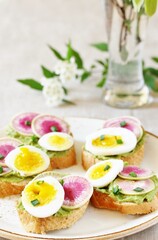 Canvas Print - watermelon radish sandwich with avocado and egg. healthy balanced breakfast. bright toast