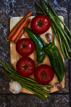 Vegetarian Still Life With Tomatoes, Green Peppers, Asparagus, Carrots And Garlic