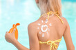 © Pixel-Shot - Little girl with sun protection cream near swimming pool