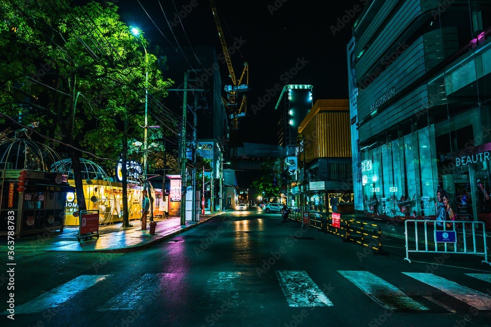 Illuminated City Street And Buildings At Night - obrazy, fototapety, plakaty 