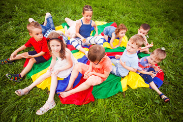 Wall Mural - The little friends are resting in the park after active games