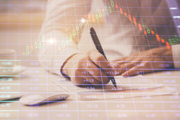 Fototapete - Financial trading chart multi exposure with man desktop background.